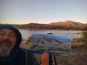 pintando un cuadro al oleo en el dique cajon